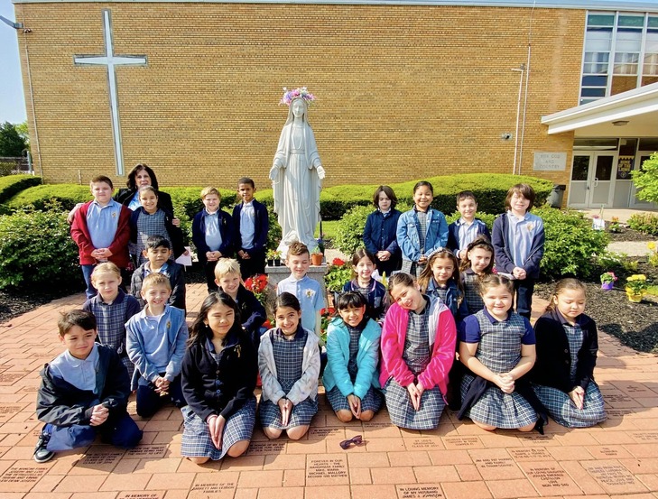 Catholic school students venerate the Blessed Virgin Mary Catholic